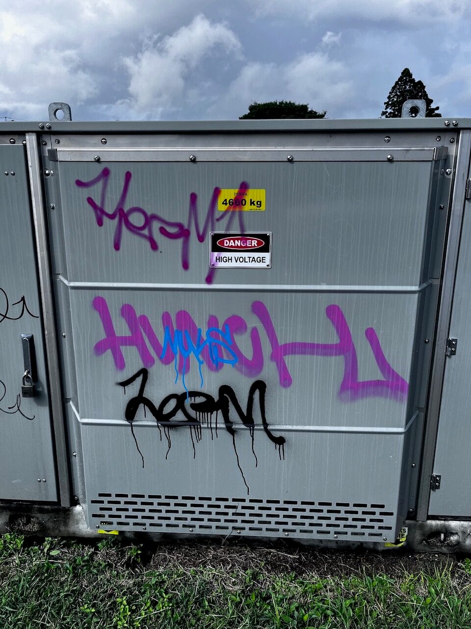 Utility cabinet with heavy graffiti before removal