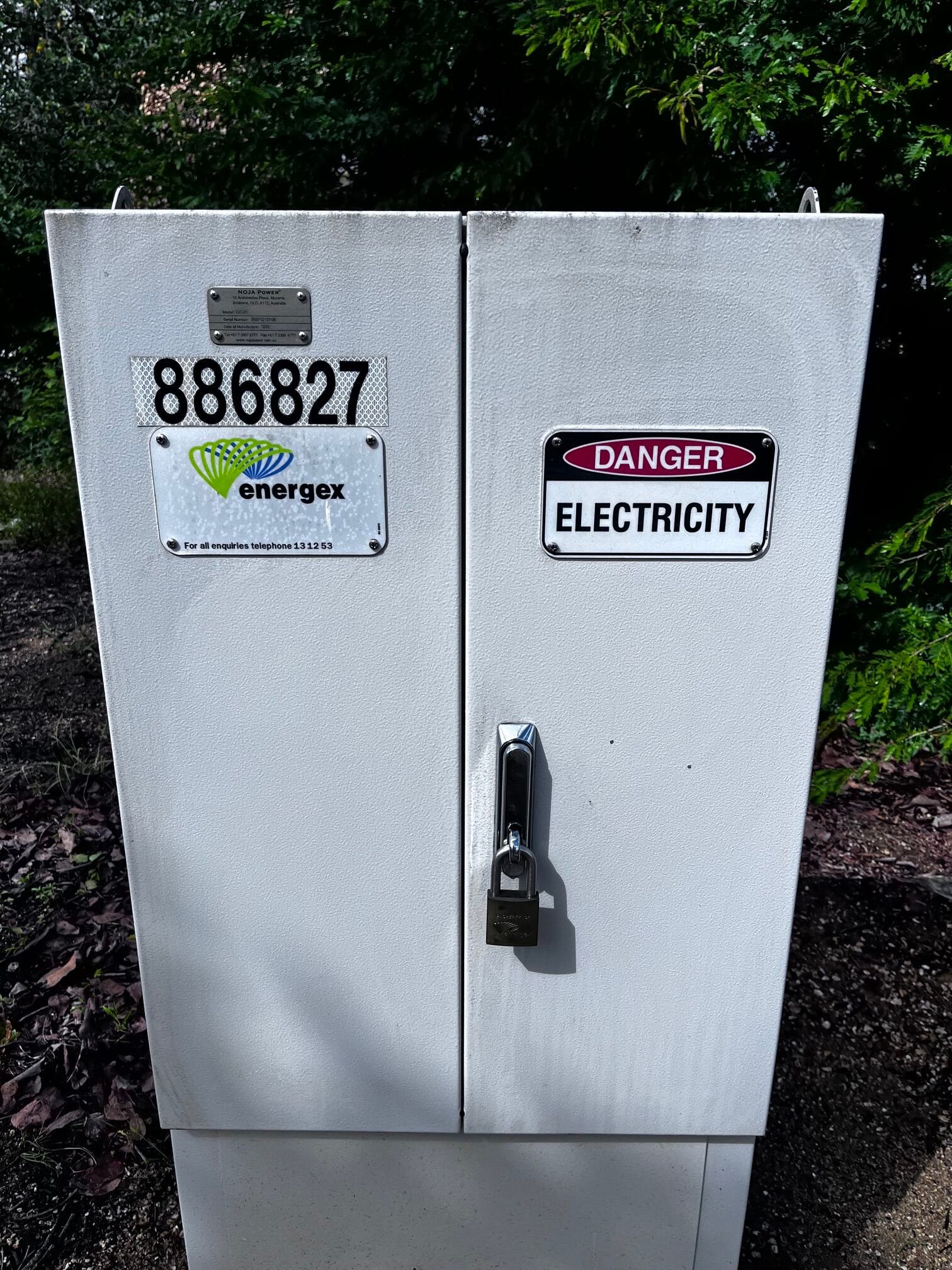 Green electrical box after graffiti removal